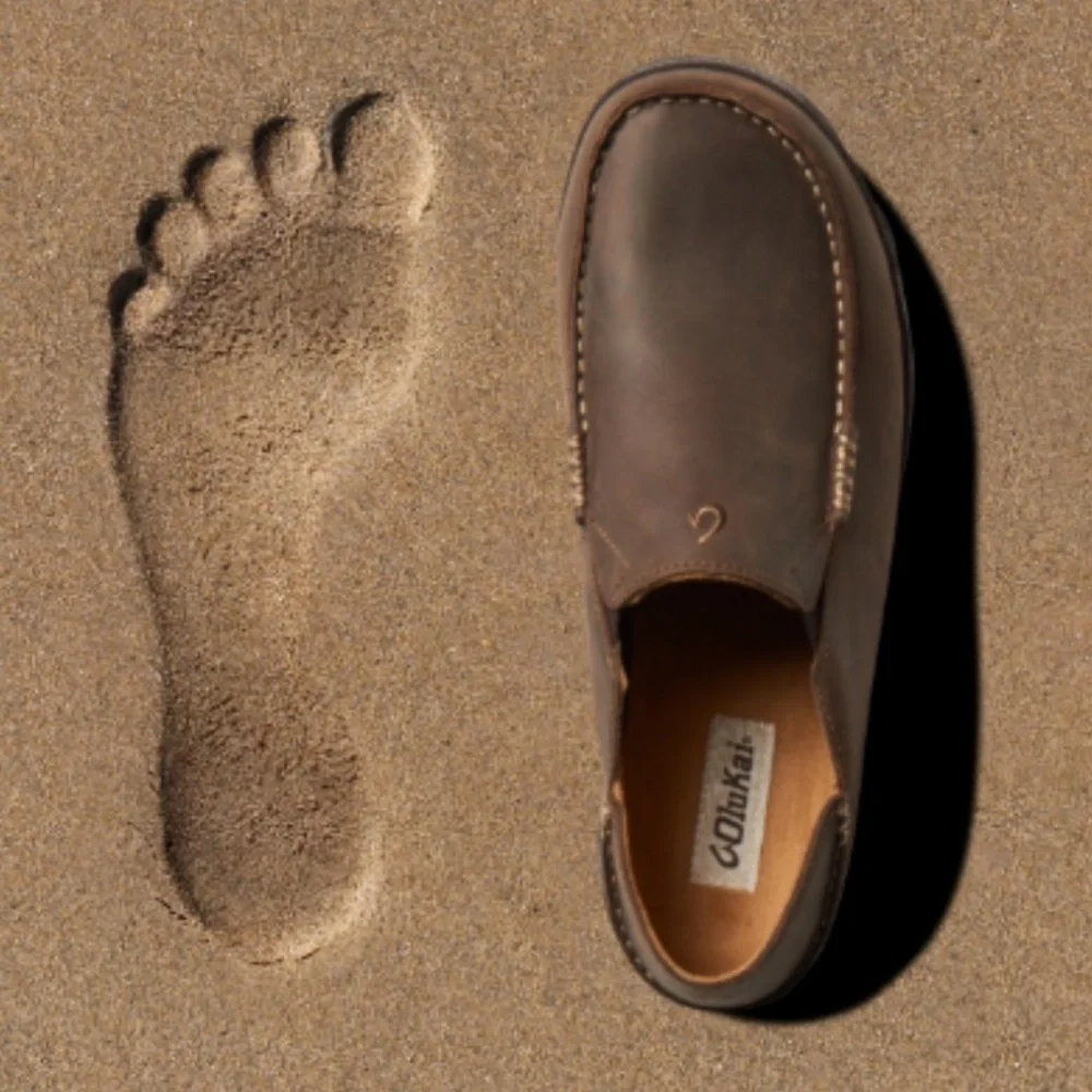 Olukai Moloa Boy's Leather Slip on shoe in a dark wood Color